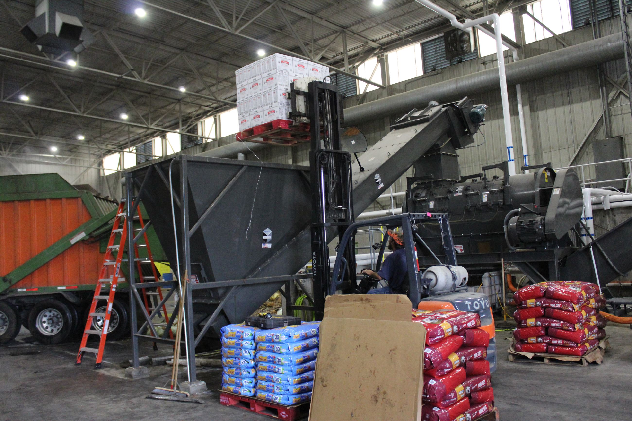 073020 MORC - Dumping product into depackager 002 (JPG)