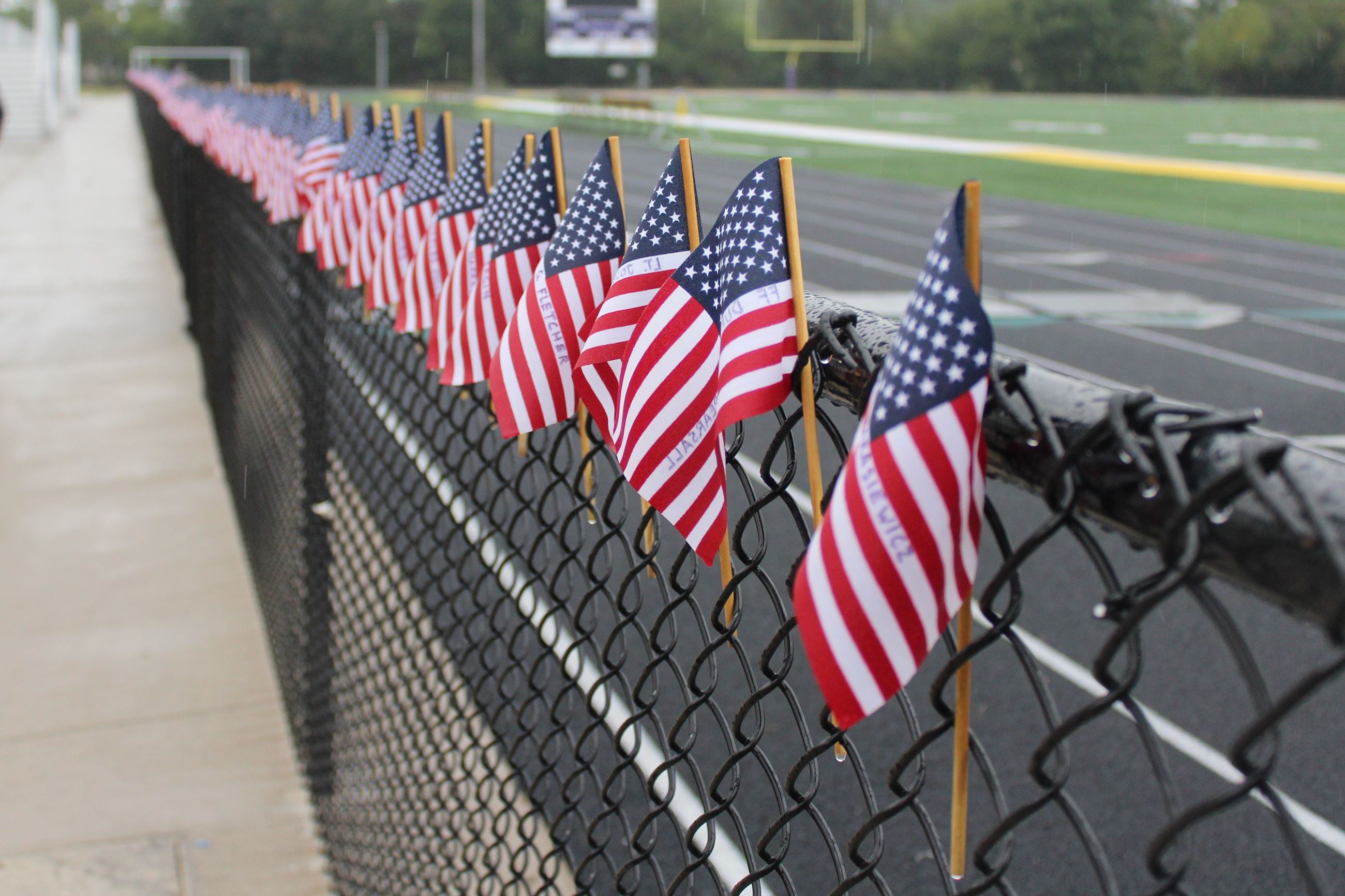 091123 Muscatine Stair Climb 004 = Row of flags with names