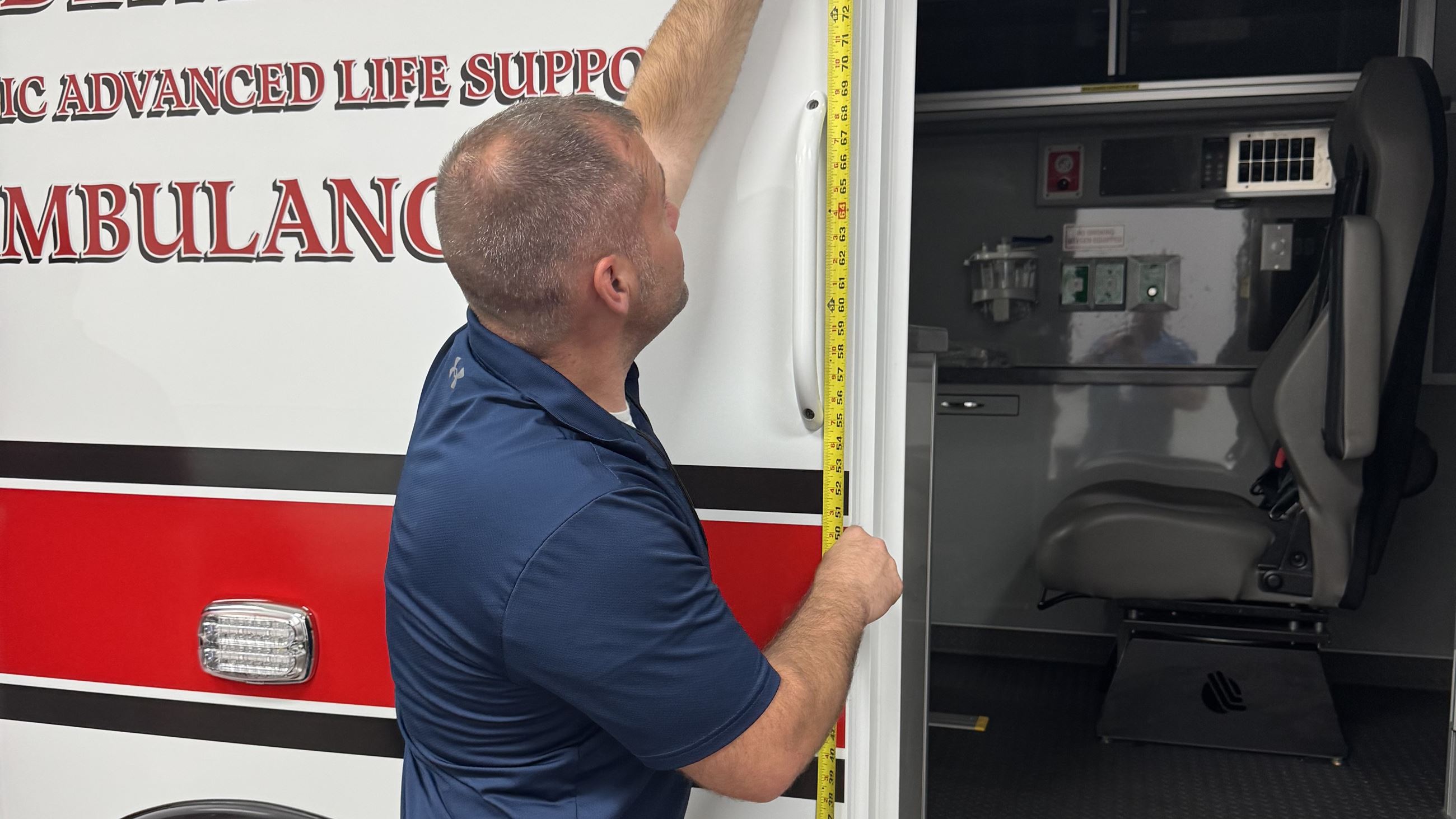 062525 New Ambulance (JPG) with Mike Collins taking measurements 