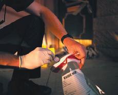 Officer putting evidence in plastic bag